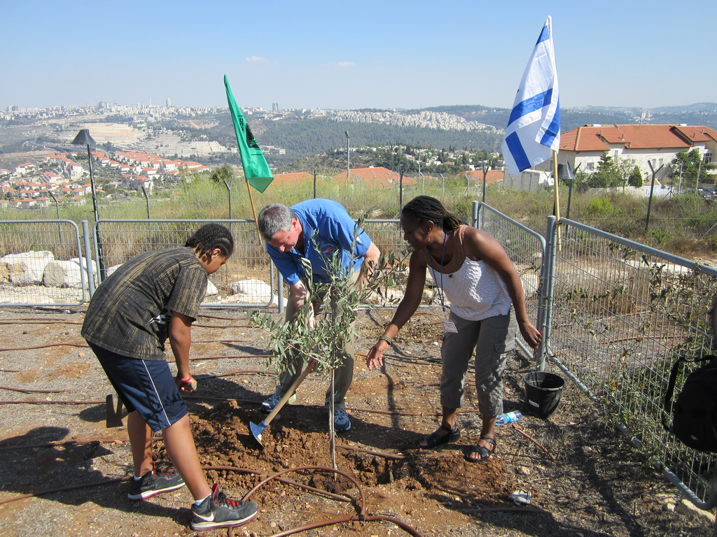 Public Advocate Bill de Blasio (center) planting a tree with wife Chirlane McCray (right) and son Dante (left) in the town of Yad Assa, just outside of Jerusalem. (photo credit: Flickr/Public Advocate Bill de Blasio)