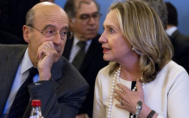 France's Foreign Minister Alain Juppe speaks with US Secretary of State Hillary Rodham Clinton at the start of an “ad hoc” meeting on Syria, in Paris, in April. (photo credit: Jacquelyn Martin/AP) France's Foreign Minister Alain Juppe speaks with US Secretary of State Hillary Rodham Clinton at the start of an “ad hoc” meeting on Syria, in Paris, in April. (photo credit: Jacquelyn Martin/AP)