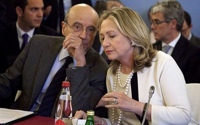 US Secretary of State Hillary Rodham Clinton speaks with French Foreign Minister Alain Juppe in Paris on Thursday, during a meeting on Syria. (photo credit: Jacquelyn Martin/AP)