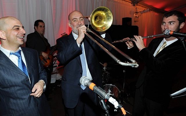Israeli UN envoy Ron Prosor plays the trombone during his rendition of 'When I'm 64' on Israel's 64th Independence Day. (photo credit: Shahar Azran/Permanent Mission of Israel to the United Nations)