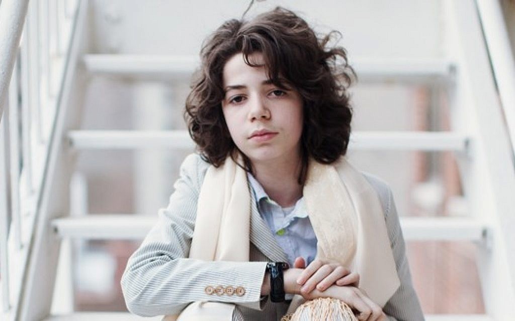 Dylan Siegel, 14, wearing his great-grandfather's tallis. (JTA)