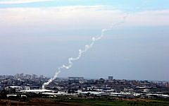 Illustrative photo of two Kassam rockets heading toward Israel shortly after they are fired by Palestinians in Gaza. (photo credit: Edi Israel/Flash90/File)