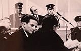 Chief prosecutor of the Eichmann trial, Israeli Attorney Gideon Hausner (left) and Justice Gabriel Bach, senior prosecutor, (middle, facing camera), during Adolf Eichmann's (back) trial in Jerusalem (photo credit: GPO/Flash90)
