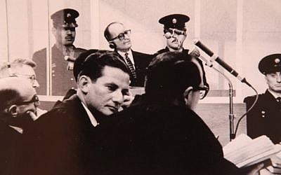 Chief prosecutor of the Eichmann trial, Israeli Attorney Gideon Hausner (left) and Justice Gabriel Bach, senior prosecutor, (middle, facing camera), during Adolf Eichmann's (back) trial in Jerusalem (photo credit: GPO/Flash90)