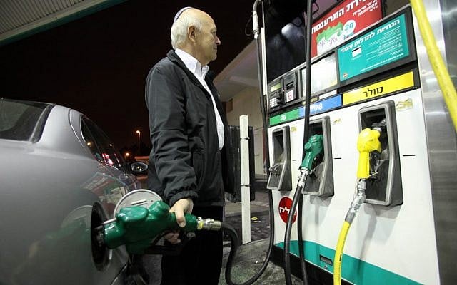 A driver fills up his car at a gas station in Jerusalem. (photo credit: Yossi Zamir/Flash 90)