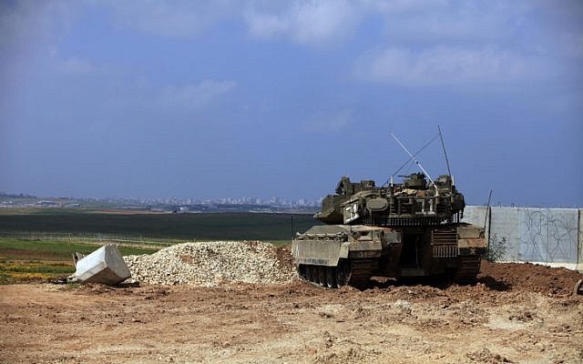 An army tank positioned on the Israel Gaza border (photo credit: Tsafrir Abayov/Flash90)