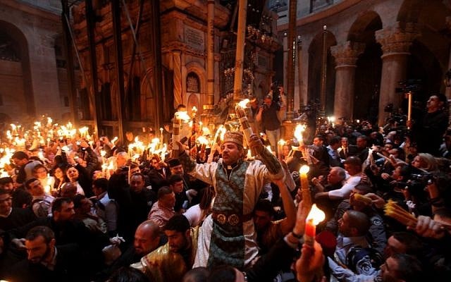 Christian worshipers take part in the "Holy Fire" ceremony at the Church of the Holy Sepulchre in Jerusalem's Old City during Easter, 2011 (photo credit: Kobi Gideon/Flash90) Christian worshipers take part in the "Holy Fire" ceremony at the Church of the Holy Sepulchre in Jerusalem's Old City during Easter, 2011 (photo credit: Kobi Gideon/Flash90)