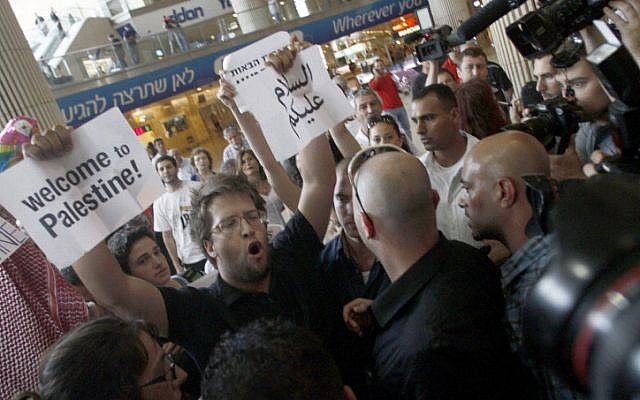 Police arrest activists at Ben Gurion Airport during last year's 'flytilla.' (photo credit: Flash90)