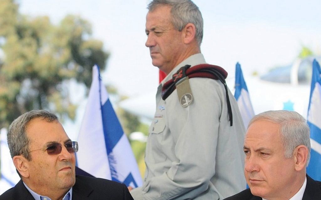 IDF Chief of Staff Benny Gantz walks by Prime Minister Benjamin Netanyahu and Defense Minister Ehud Barak in 2011. (photo credit: Yossi Zeliger/Flash90)