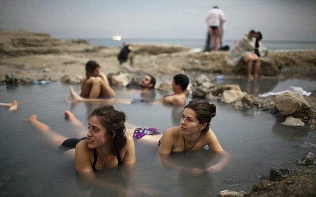 Israelis enjoying the Dead Sea’s hot water springs (photo credit: Matanya Tausig/Flash90)