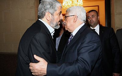 Palestinian Authority President Mahmoud Abbas meets with Hamas leader Khaled Mashaal in February (photo credit: Mohammed al-Hums/Flash90)