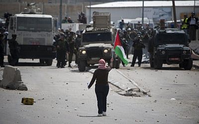 A protest at the Kalandia checkpoint north of Jerusalem. The scream is mounted atop the middle jeep (Photo credit: Yonatan Sindel/ Flash 90) A protest at the Kalandia checkpoint north of Jerusalem. The scream is mounted atop the middle jeep (Photo credit: Yonatan Sindel/ Flash 90)
