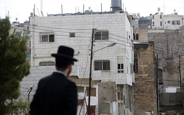 An ultra-Orthodox Jewish man walks past Beit Hamachpela in Hebron. (photo credit: Uri Lenz/Flash 90) An ultra-Orthodox Jewish man walks past Beit Hamachpela in Hebron. (photo credit: Uri Lenz/Flash 90)