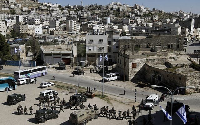 Security forces surround Beit Hamachpela in Hebron. (photo credit: Miriam Alster/Flash90)