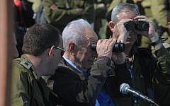 President Shimon Peres and IDF Chief of Staff Lt. Gen. Benny Gantz observe a military exercise on the Golan Heights in April 2012. (photo credit: Mark Neyman/GPO/Flash90)