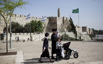 An ultra orthodox Jewish family enjoying the Jewish holiday of Passover at the old city in Jerusalem. (photo credit: Yonatan Sindel/Flash90)