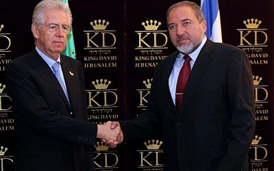Foreign Minister Avigdor Lieberman greets Italian Prime Minister Mario Monti in Jerusalem on Sunday (photo credit: Yossi Zamir/Flash90)