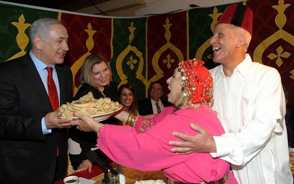 Benjamin and Sara Netanyahu celebrating the Mimouna, a traditional Jewish-Moroccan holiday that follows the end of passover (Amos Ben Gershom/Flash90) Benjamin and Sara Netanyahu celebrating the Mimouna, a traditional Jewish-Moroccan holiday that follows the end of passover (Amos Ben Gershom/Flash90)