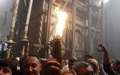Orthodox Christian worshippers take part in the Holy Fire ceremony at the Church of the Holy Sepulcher in Jerusalem's Old City. (photo credit: Uri Lenz/Flash90) Orthodox Christian worshippers take part in the Holy Fire ceremony at the Church of the Holy Sepulcher in Jerusalem's Old City. (photo credit: Uri Lenz/Flash90)