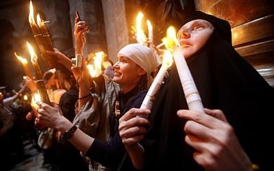 Orthodox Christian worshippers take part in the Holy Fire ceremony at the Church of the Holy Sepulcher in Jerusalem's Old City. (photo credit: Uri Lenz/Flash90) Orthodox Christian worshippers take part in the Holy Fire ceremony at the Church of the Holy Sepulcher in Jerusalem's Old City. (photo credit: Uri Lenz/Flash90)