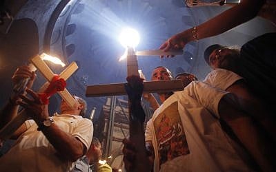 Orthodox Christian worshippers take part in the Holy Fire ceremony at the Church of the Holy Sepulcher in Jerusalem's Old City. (photo credit: Uri Lenz/Flash90) Orthodox Christian worshippers take part in the Holy Fire ceremony at the Church of the Holy Sepulcher in Jerusalem's Old City. (photo credit: Uri Lenz/Flash90)