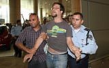 Left-wing activist detained at Ben Gurion Airport for participating in the 'Welcome to Palestine' protest (photo credit: Gideon Markowicz/Flash90)