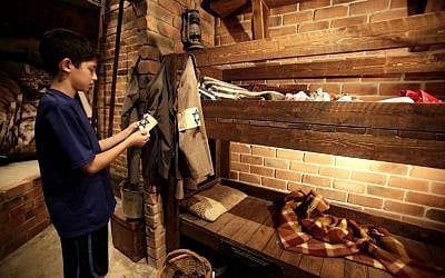 An Israeli boy inside a reconstructed bunker at the 'From Holocaust to Revival' museum in Kibbutz Yad Mordechai (photo credit: Flash90)