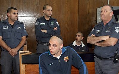 Gigi (foreground) and Biton (seated behind him) in court on Tuesday. (photo by: Gideon Markowicz/Flash90)