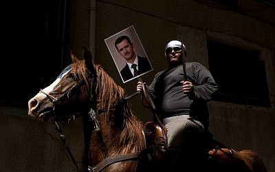 A Druze man in the Golan Heights rallying in support of Bashar Assad in April. (photo credit: Matanya Tausig/Flash90)