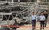 In this 2012 photo, a police officer stands near the scene where a large lighting rig collapsed and killed Lt. Hila Betzaleli. (Nati Shohat/Flash90)