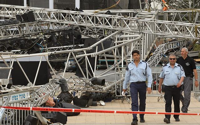 Police at the scene where a large lighting rig, prepared for next week's Memorial Day and Independence Day ceremonies at Mount Herzl, collapsed on Wednesday. (photo credit: Nati Shohat/Flash90)