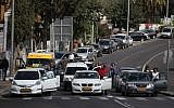 Israelis pause at a Jerusalem intersection for two minutes on Holocaust Remembrance Day (photo credit: Avishag Shar/Yashuv/Flash90)