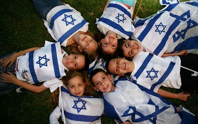 Illustrative: Children wave Israeli flags on last year's Independence Day. (photo credit: Yehoshua Yosef /Flash90) Illustrative: Children wave Israeli flags on last year's Independence Day. (photo credit: Yehoshua Yosef /Flash90)