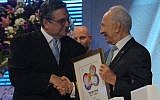 Veteran Israeli journalist Yaakov Achimeir receives the prestigious Israel Prize from President Shimon Peres (photo credit: Mark Neyman/GPO/FLASH90)