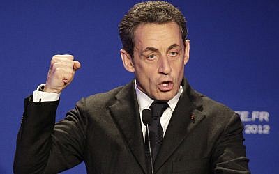 French President Nicolas Sarkozy gestures as he delivers a speech during a campaign meeting outside Paris on Thursday. (photo credit: Michel Euler/AP)