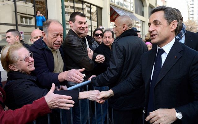 French president and conservative candidate for the 2012 presidential election, Nicolas Sarkozy shakes hands with people as he arrives for a campaign meeting in April (photo credit: AP/Eric Feferberg) French president and conservative candidate for the 2012 presidential election, Nicolas Sarkozy shakes hands with people as he arrives for a campaign meeting in April (photo credit: AP/Eric Feferberg)