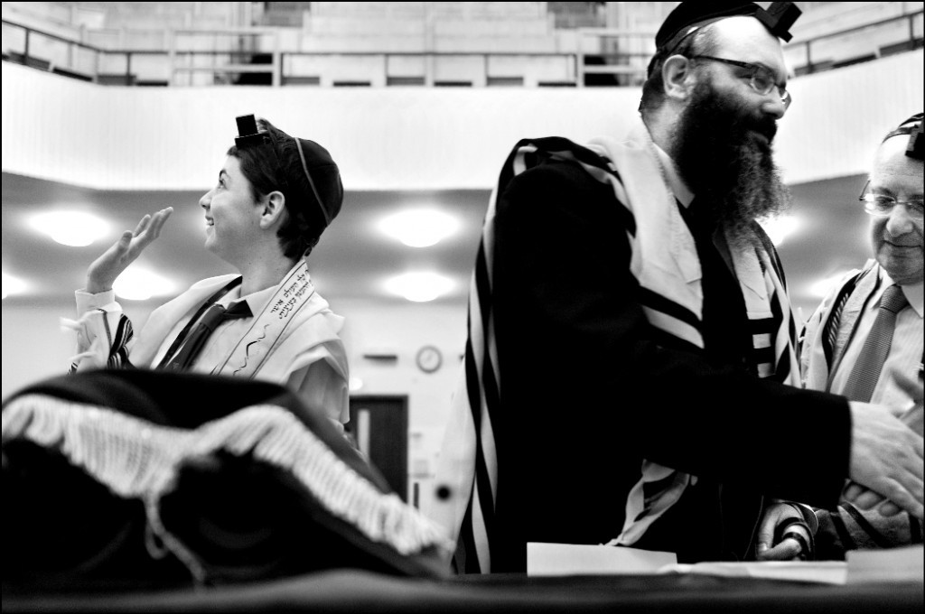 Glasgow 2010. A bar mitzva boy in an Orthodox synagogue waves to his mother who sits in the balcony. (photo credit: Judah Passow)