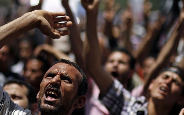 Why are Egypt's Islamists no longer staying away from the streets? (photo credit: AP)