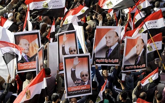 File photo of Egyptians holding posters supporting Omar Suleiman, in Cairo, Egypt last December. (photo credit: AP/Amr Nabil, File)