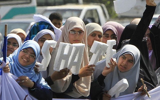 Egyptian women supporting Muslim Brotherhood presidential hopeful Khairat el-Shater, in Cairo, on Thursday (photo credit: AP/Amr Nabil) Egyptian women supporting Muslim Brotherhood presidential hopeful Khairat el-Shater, in Cairo, on Thursday (photo credit: AP/Amr Nabil)