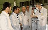 Iranian President Mahmoud Ahmadinejad, second from left, visits a nuclear research facility in Tehran in February 2012 (photo credit: AP/Iranian President's Office)