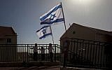 Israeli flags fly over the Ulpana outpost on the outskirts of Beit El, a settlement in the West Bank (photo credit: AP)