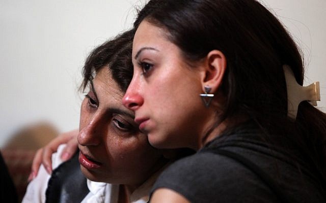 Relatives mourn for Ali Shaaban, a television cameraman working who was shot dead on the Lebanon-Syria border (photo credit: AP/Bilal Hussein)