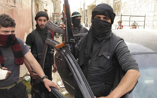 Free Syrian Army fighters are seen in a neighborhood of Damascus, Syria, on Sunday. (photo credit: AP) Free Syrian Army fighters are seen in a neighborhood of Damascus, Syria, on Sunday. (photo credit: AP)