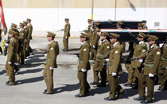 In this photo released by Syria's official news agency SANA, Syrian honor guard soldiers carry the coffins of army soldiers who were killed in recent violence in the country, April 24, 2012 (AP Photo/SANA)