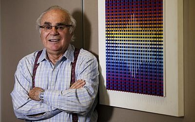 Murray Koppelman in his Manhattan office next to a work by the Israeli artist Yaacov Agam. (photo credit: Jonathan Lantz/JTA)