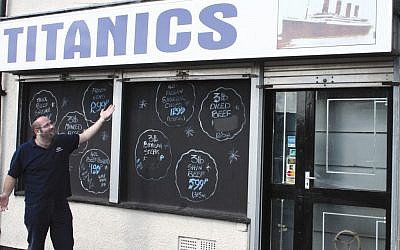 Richard Hyman, great-grandson of Titanic survivor Joseph Abraham Hyman, in front of the family business his great-grandfather started a year after the ship sank (photo credit: J.A.Hyman Titanics Ltd.)