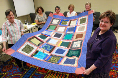 Susy Rothschild, lower right, and the other members of the West Side Quilting Bee have produced a scrap quilt destined for Israel. The group meets regularly at the Westside library branch at Belvidere and N. Mesa. The other quilters are from left: Gail Mark, Dolly Montiel, Pat Baca, Inga Ewozniak and Ann Geiyer. Rudy Gutierrez/El Paso Times