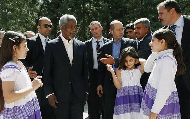 Syrian children greet Kofi Annan in a Turkish refugee camp in April (photo credit: AP/Umit Bektas)