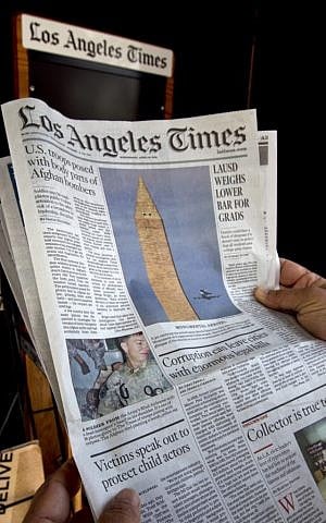 The front page of the Los Angeles Times's April 18th newspaper (photo credit: AP/Damian Dovarganes)